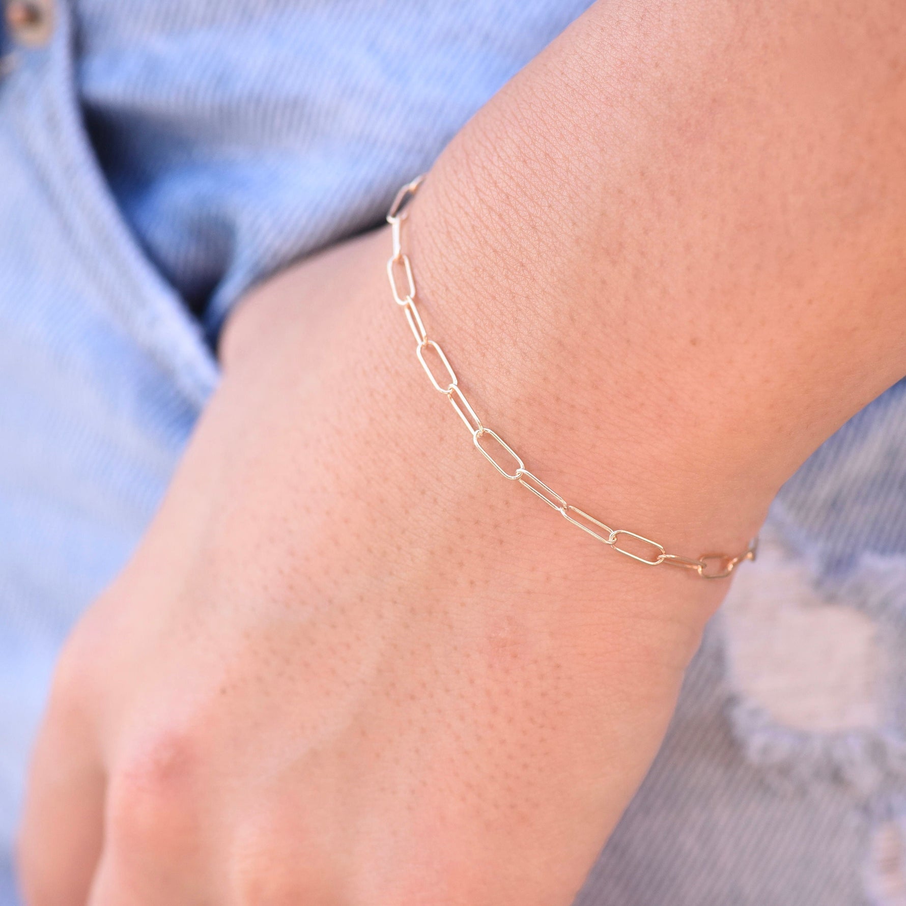 Minimalist 14K solid gold paper clip chain bracelet, 3mm wide. Perfect for everyday wear, stacking, or gifting. Durable, elegant, and timeless.