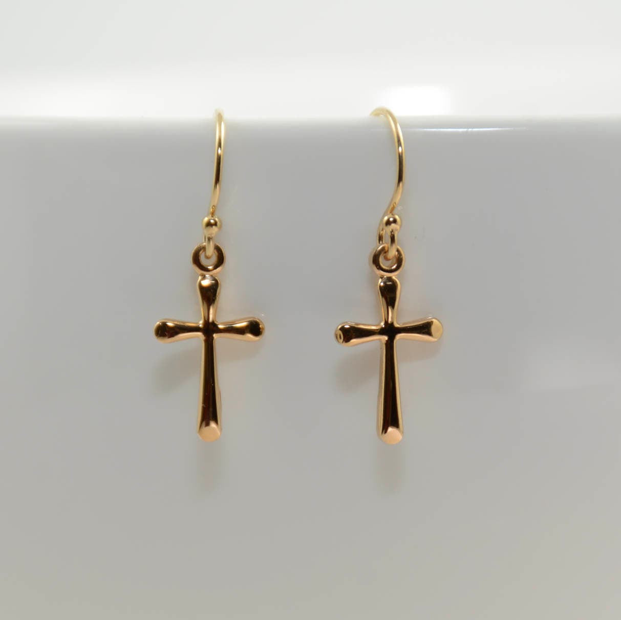 Small gold filled cross earrings with delicate faith design