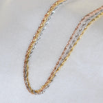 14K gold dainty tri-color Singapore chain bracelet with sparkling accents, designed by Sash Jewelry.