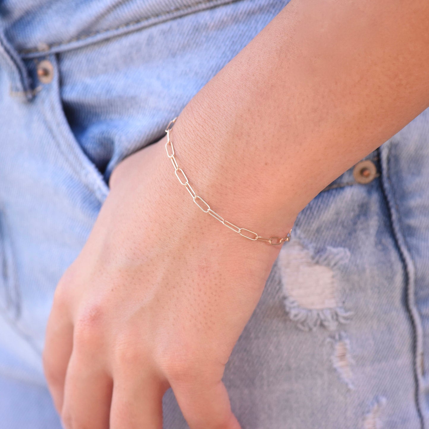Minimalist 14K solid gold paper clip chain bracelet, 3mm wide. Perfect for everyday wear, stacking, or gifting. Durable, elegant, and timeless.