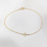 Minimal horizontal cross bracelet in solid 14K yellow gold