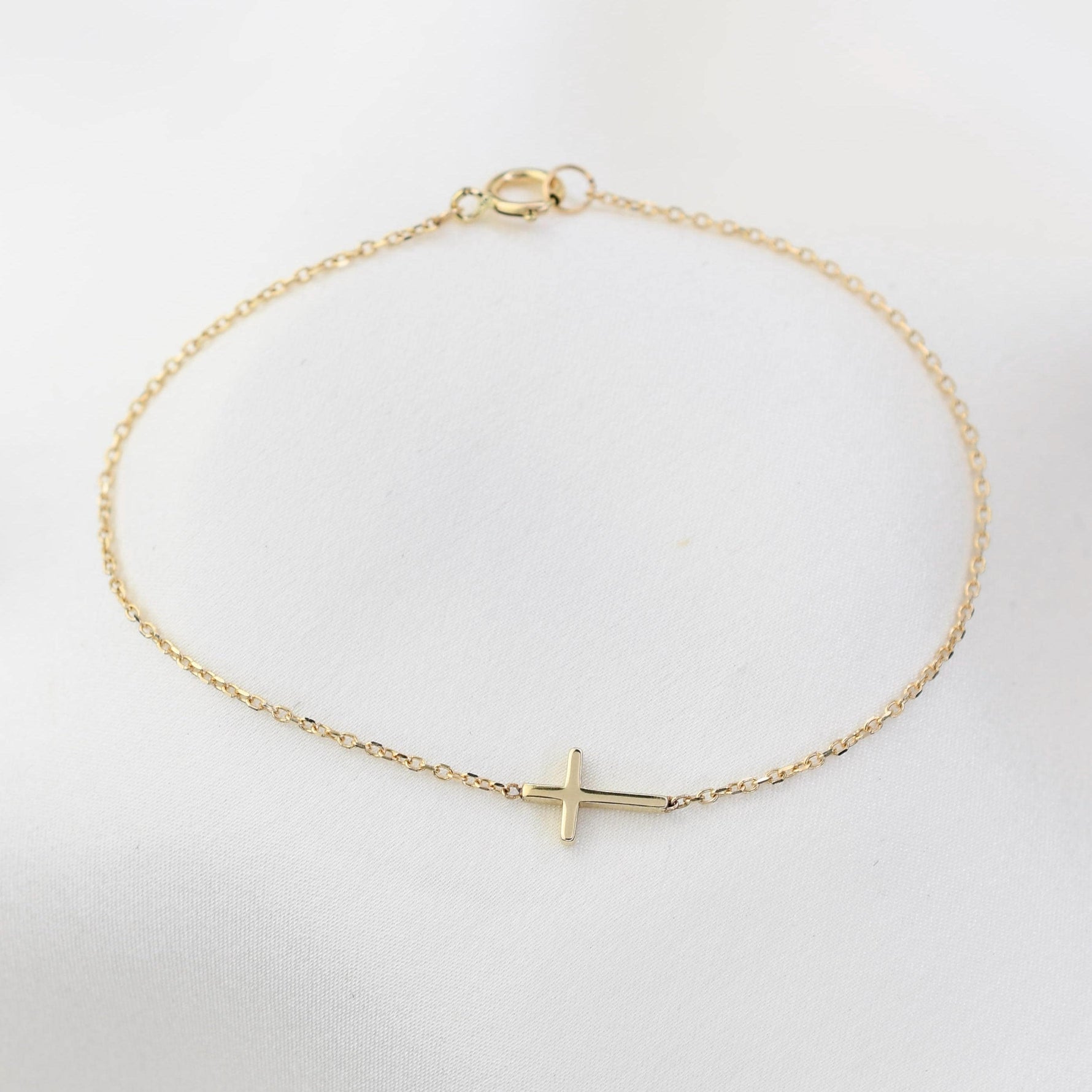 Minimal horizontal cross bracelet in solid 14K yellow gold