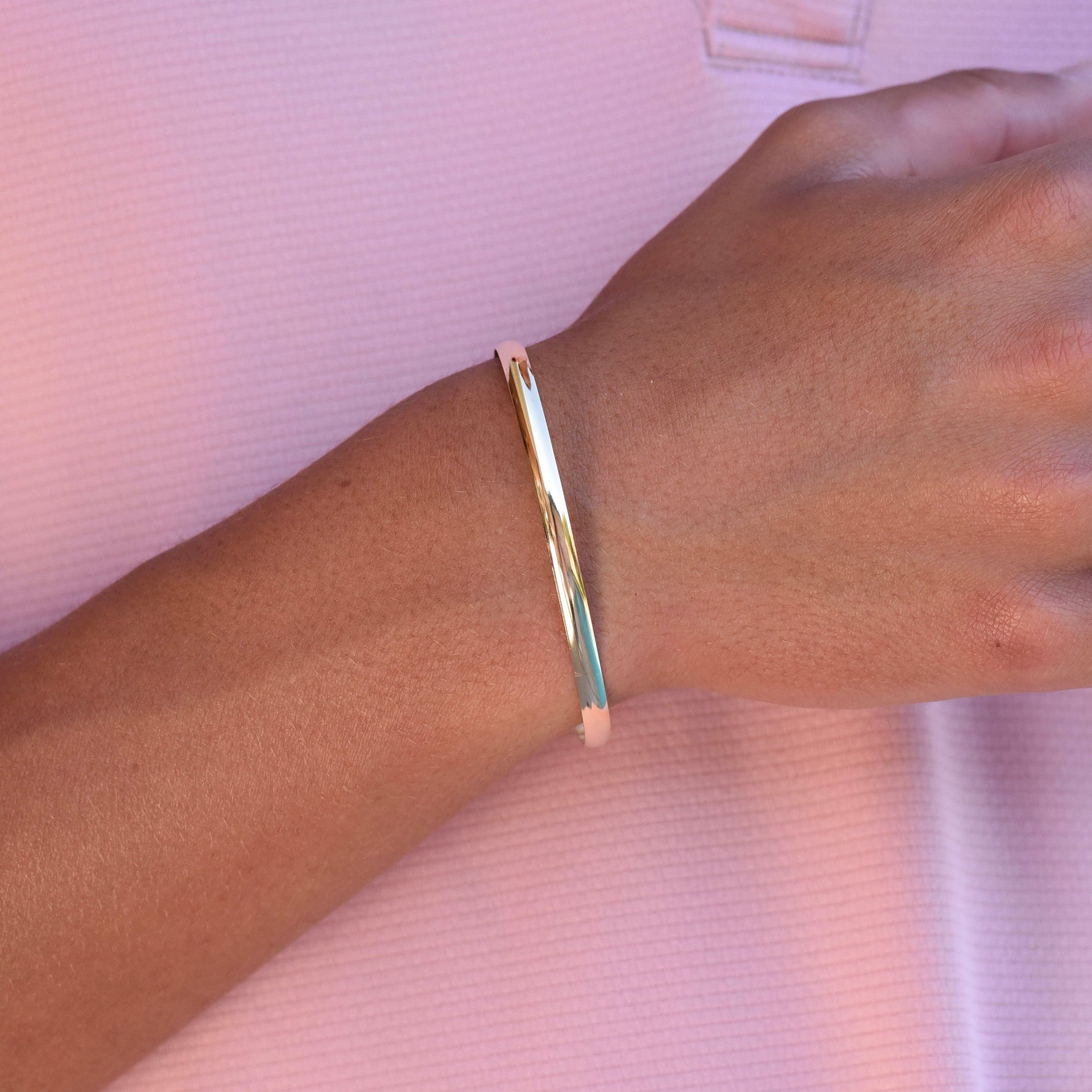Gold bracelet on a wrist 