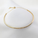Gold necklace on a white background