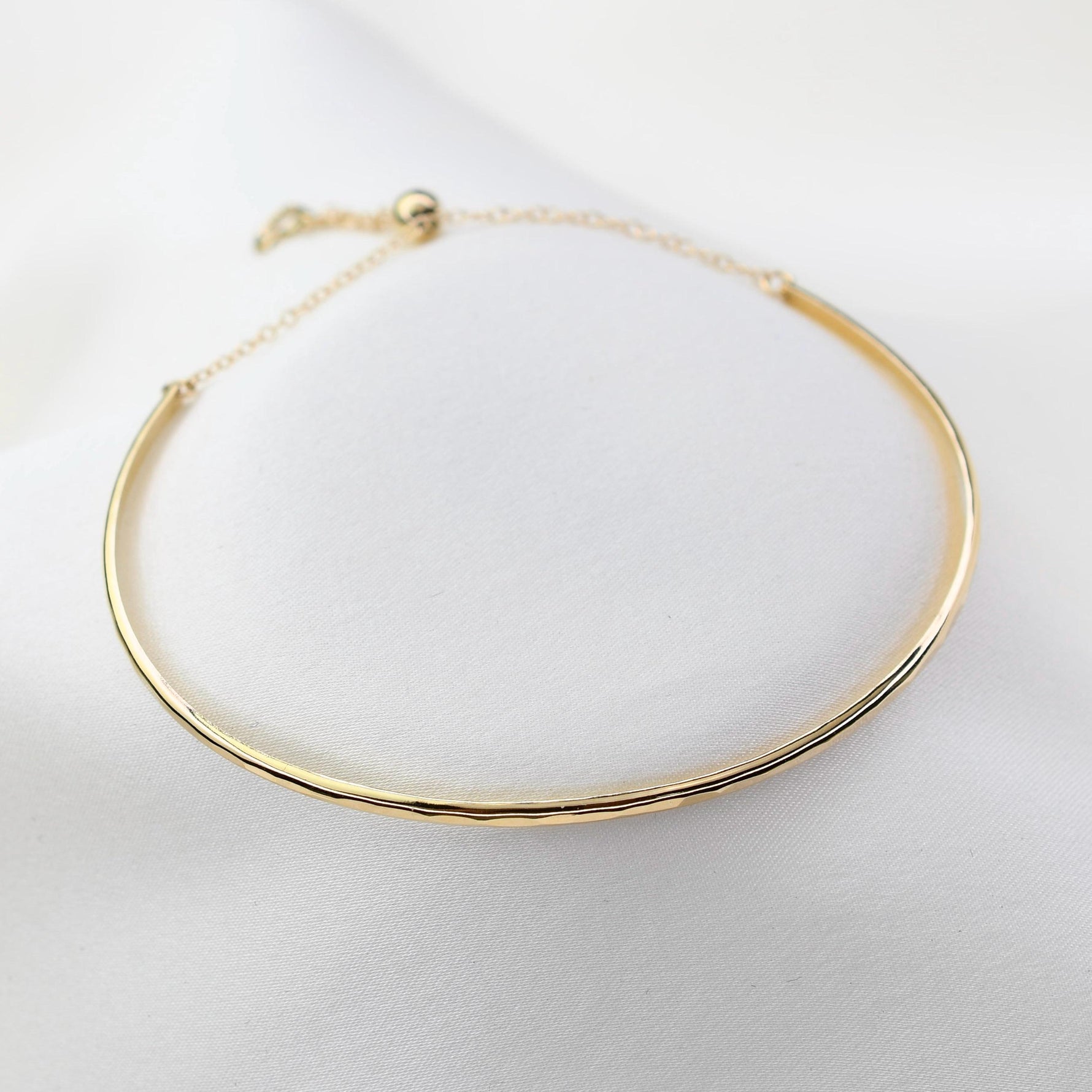 Gold necklace on a white background