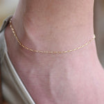 14K gold delicate anklet from Sash Jewelry featuring a dainty solid gold chain with extension for adjustable fit.