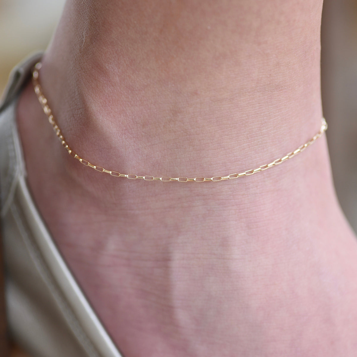14K gold delicate anklet from Sash Jewelry featuring a dainty solid gold chain with extension for adjustable fit.