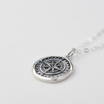 compass necklace 
