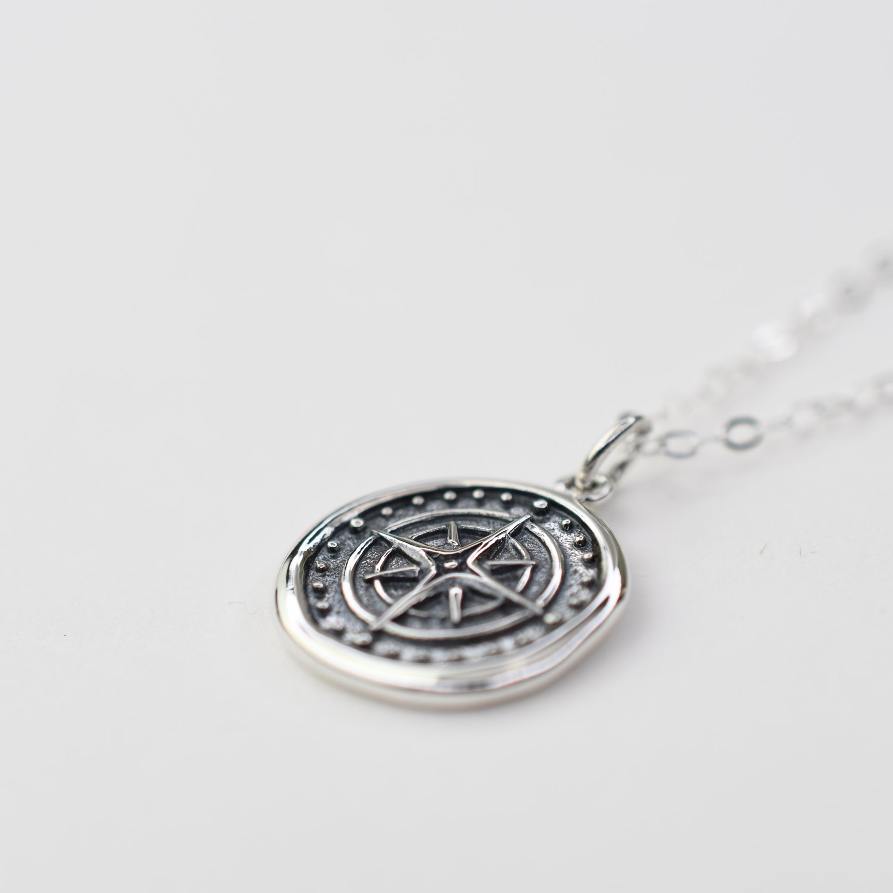 compass necklace 
