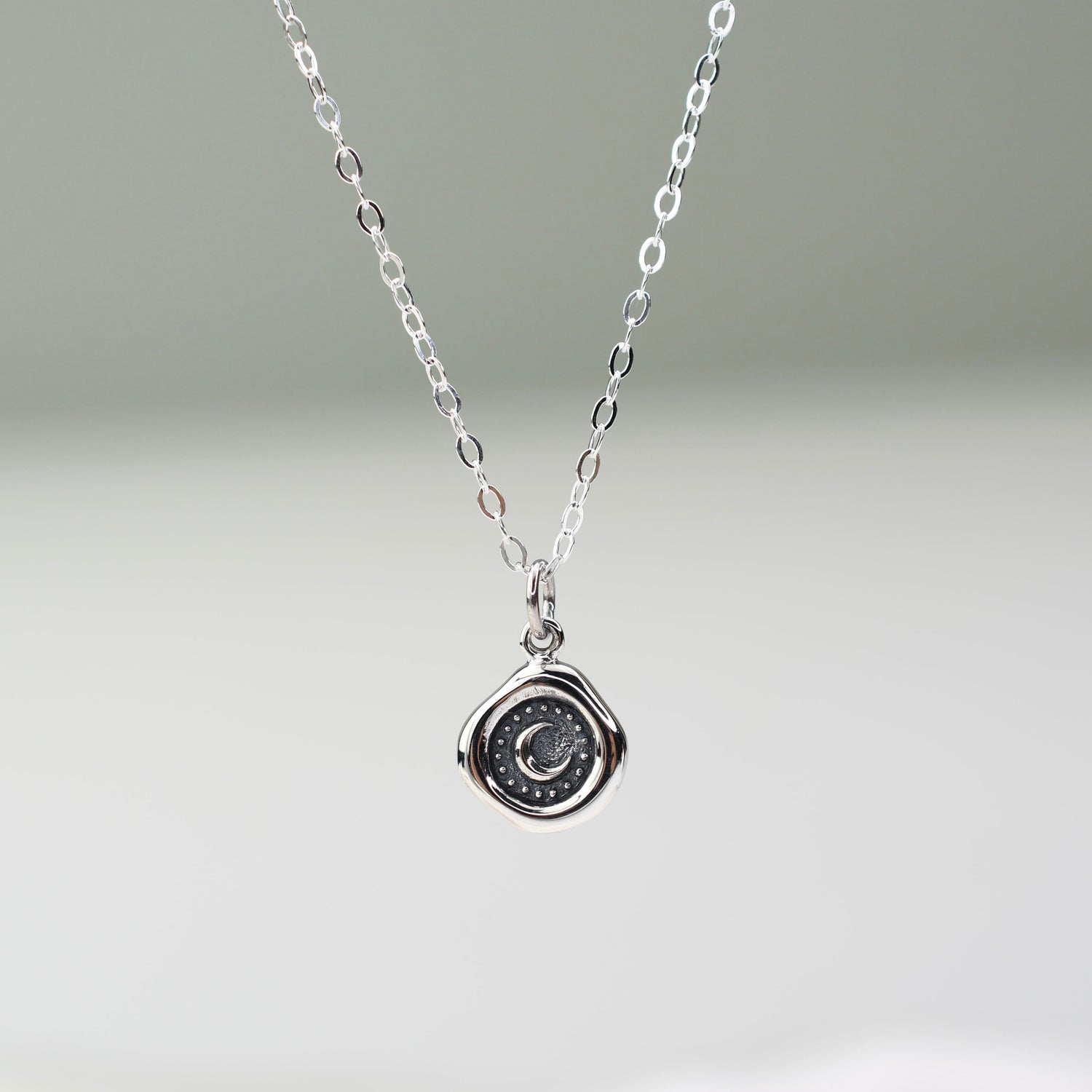 Sterling silver crescent moon wax seal necklace with 17mm x 10mm charm on silver chain