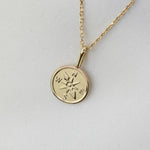 Gold necklace with a compass pendant 14k