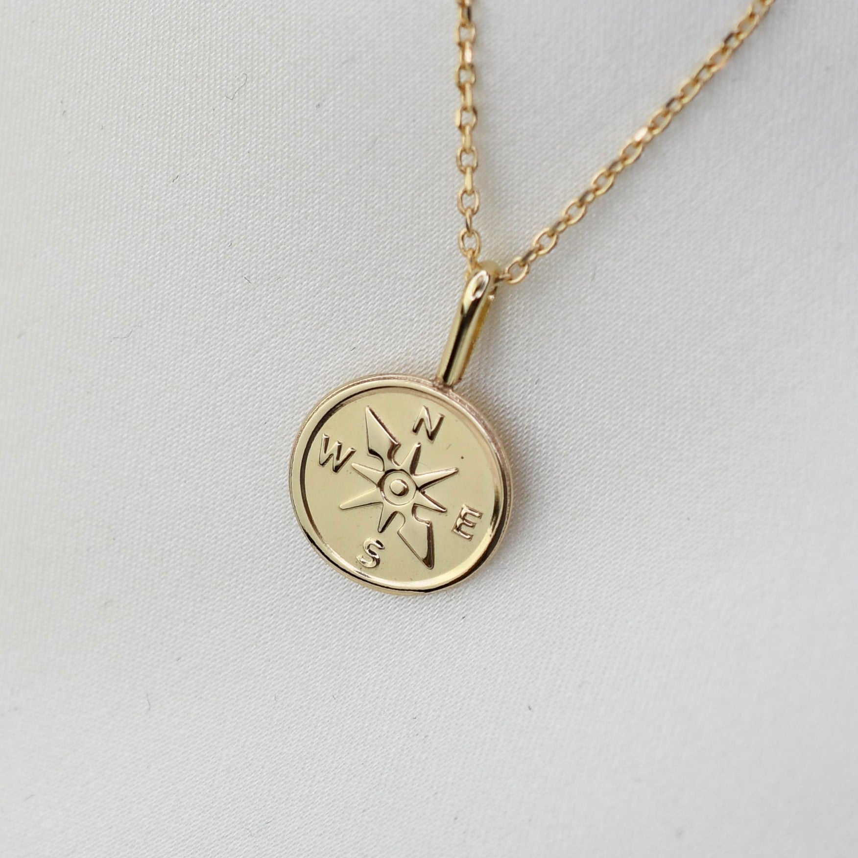 Gold necklace with a compass pendant 14k