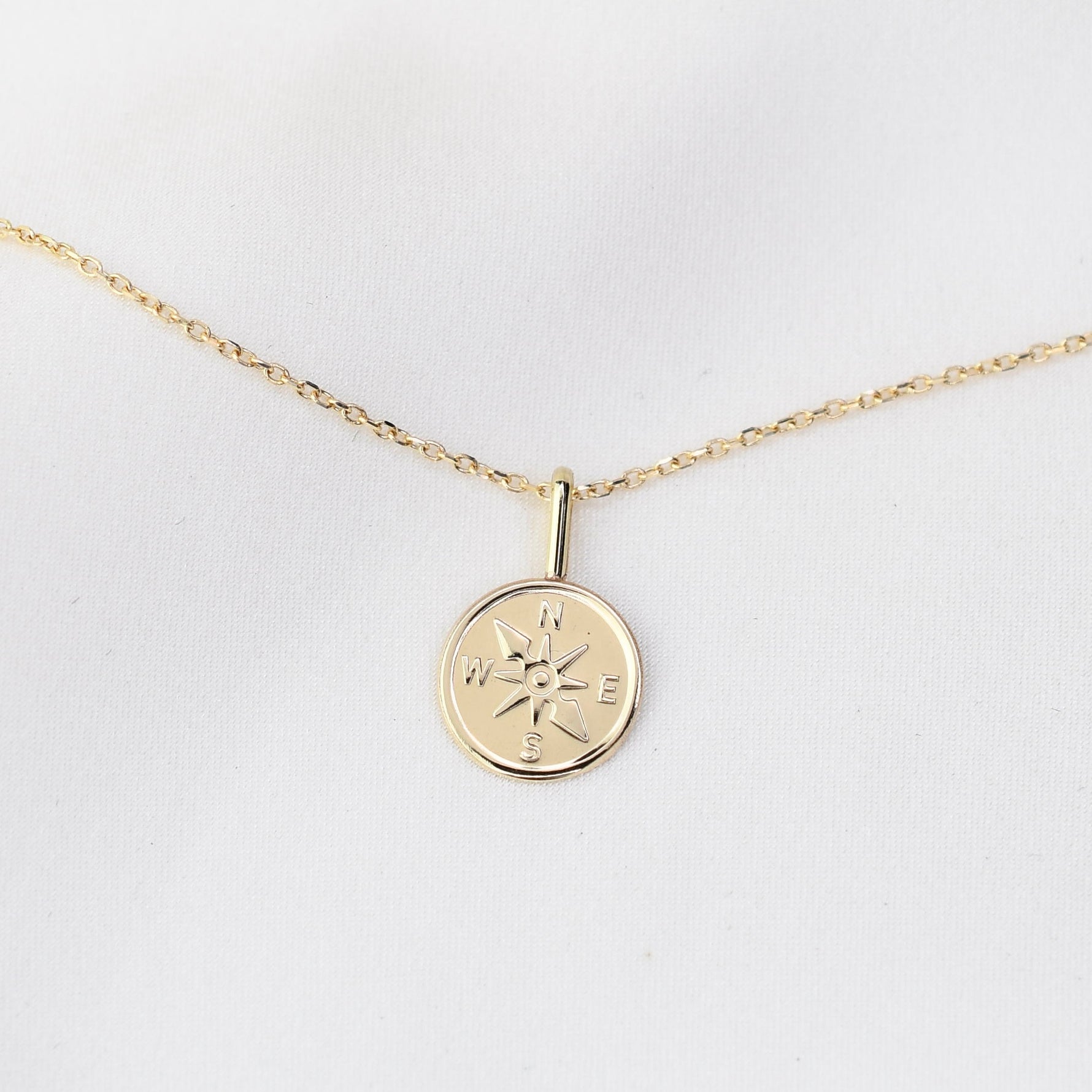 14k Gold necklace with a compass pendant