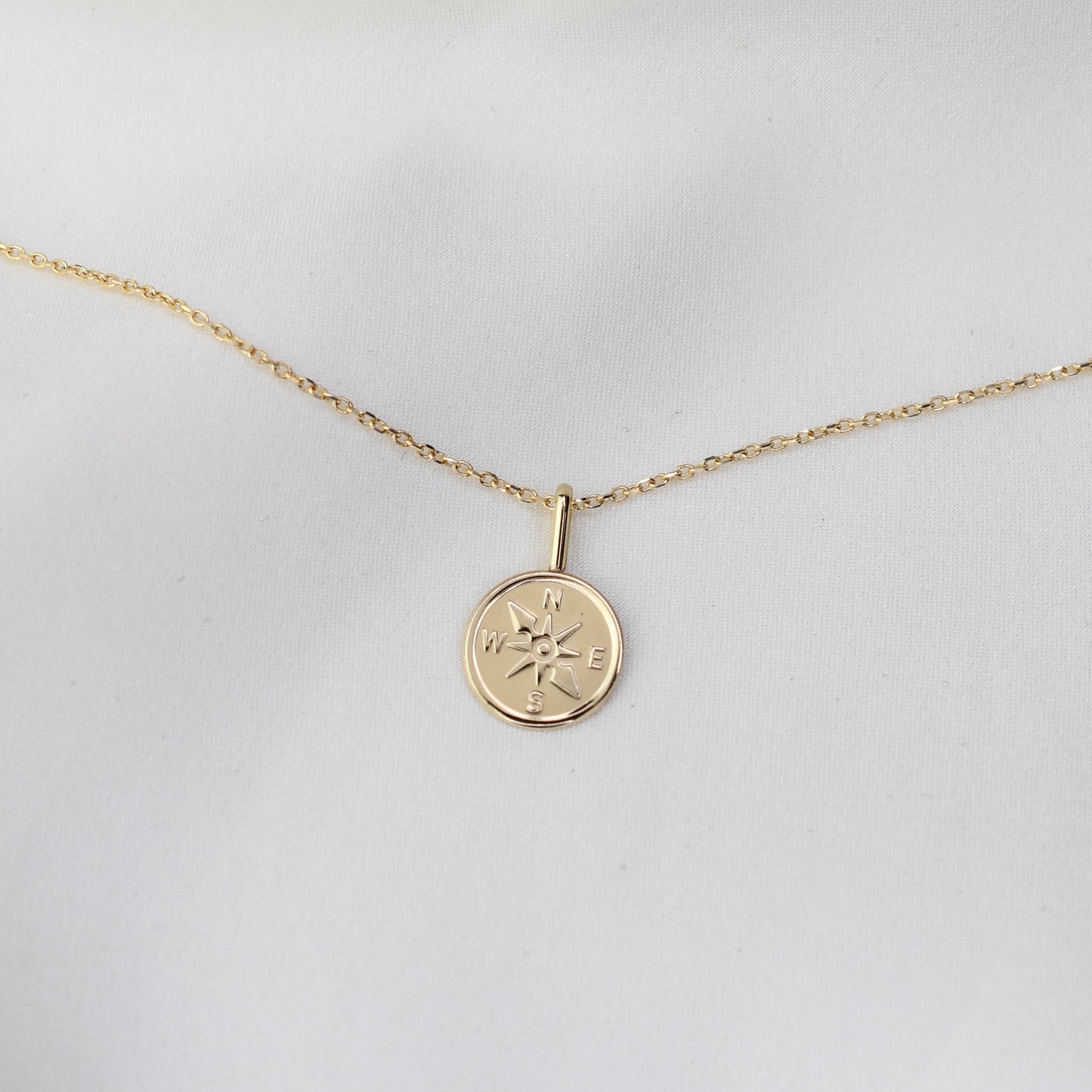 Gold necklace with a compass pendant 14k
