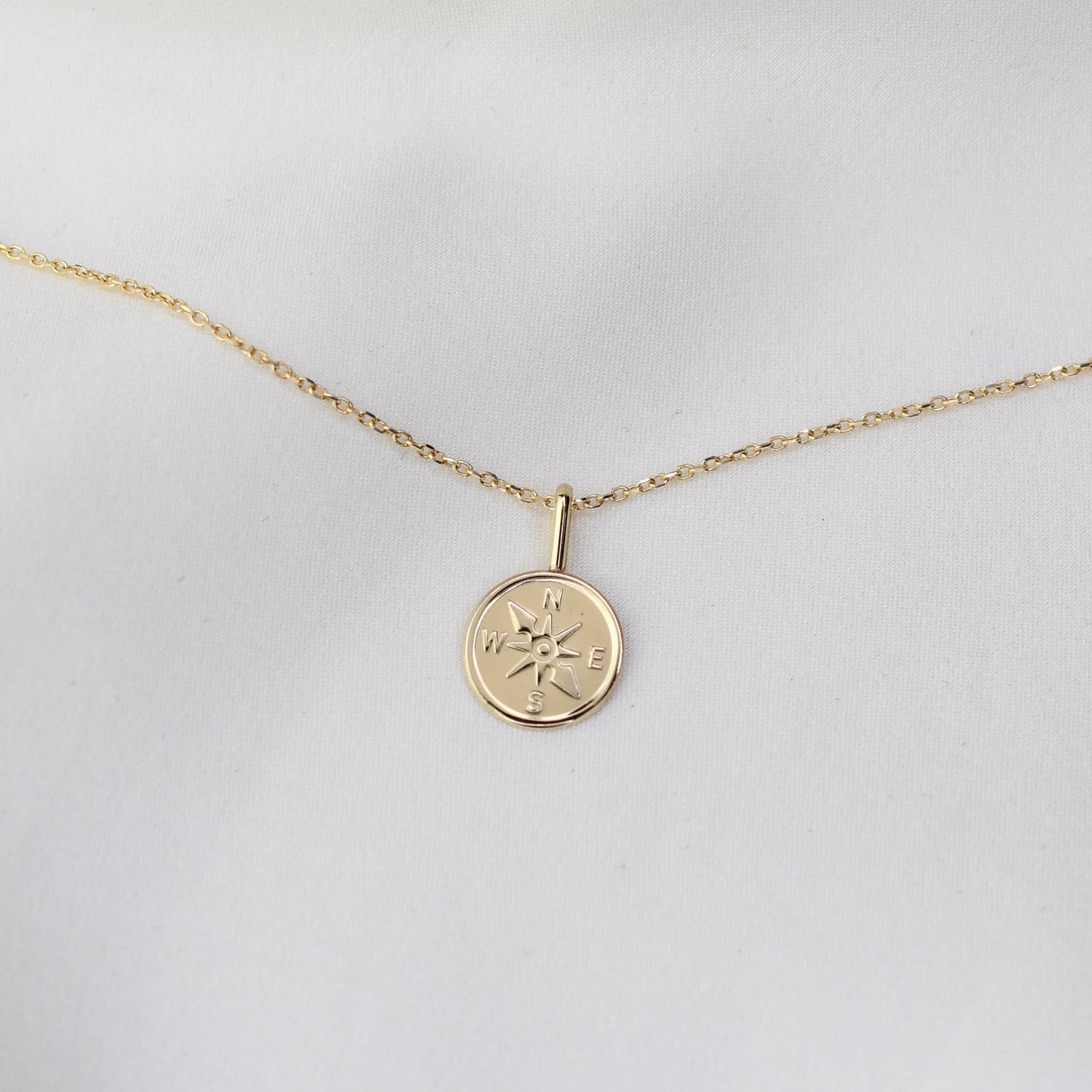 Gold necklace with a compass pendant 14k