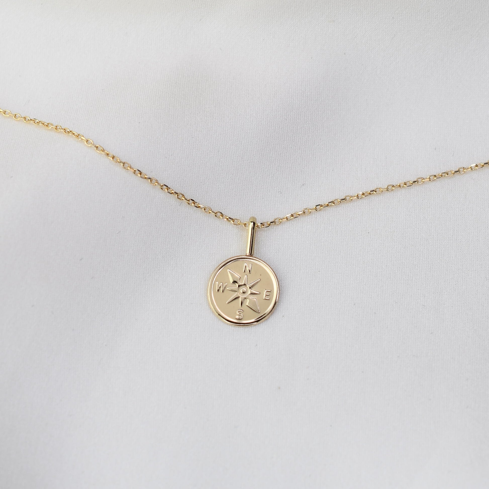 Gold necklace with a compass pendant 14k
