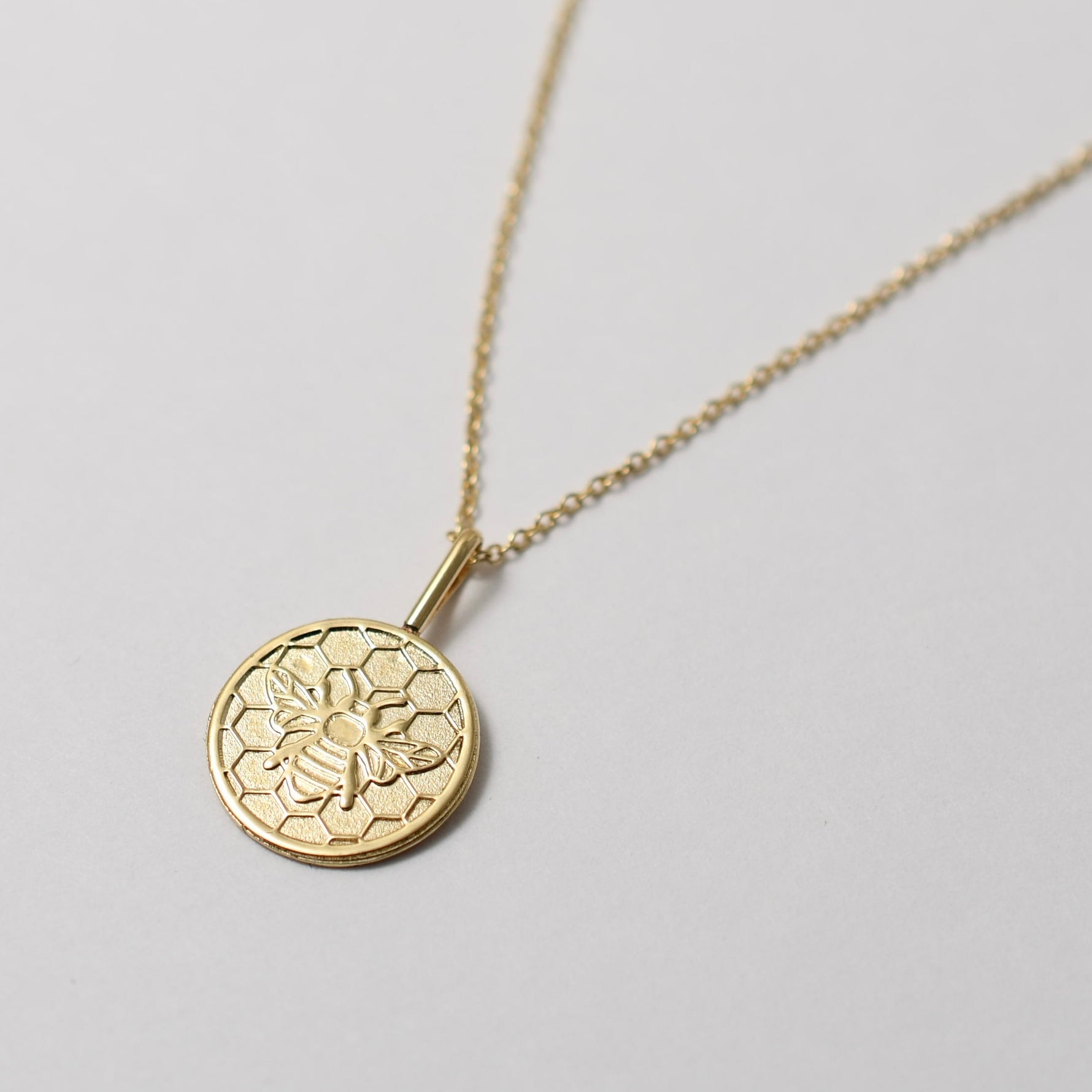 14K solid gold honeycomb bee charm necklace on delicate chain