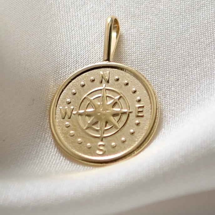 solid gold compass charm necklace close up