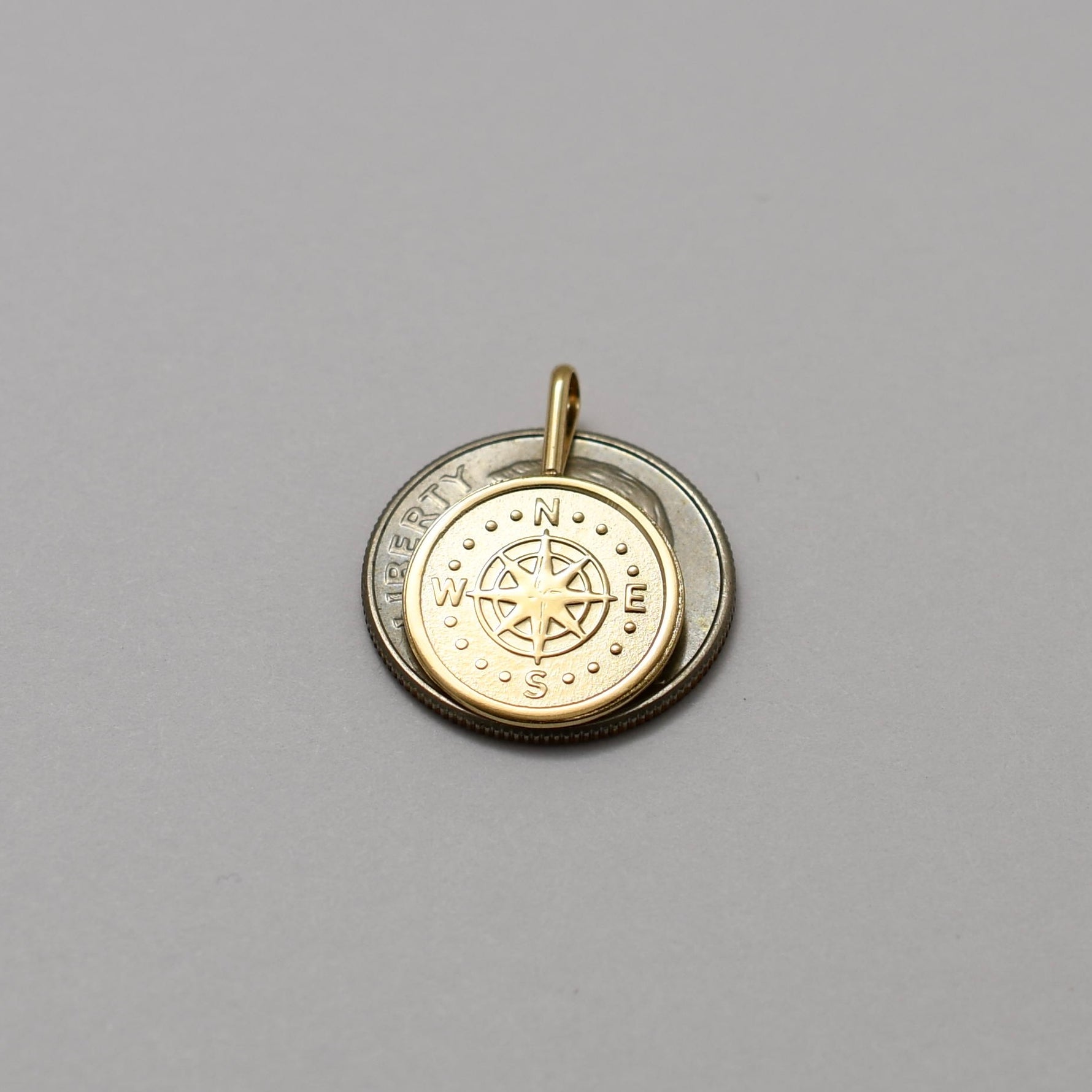 14k gold compass pendant
