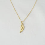 14K solid gold angel wing necklace by Sash Jewelry, featuring detailed feather design and elegant chain.