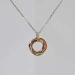 14K solid gold three interlocking rings necklace in yellow, white, and rose gold with an adjustable 16–18" chain.