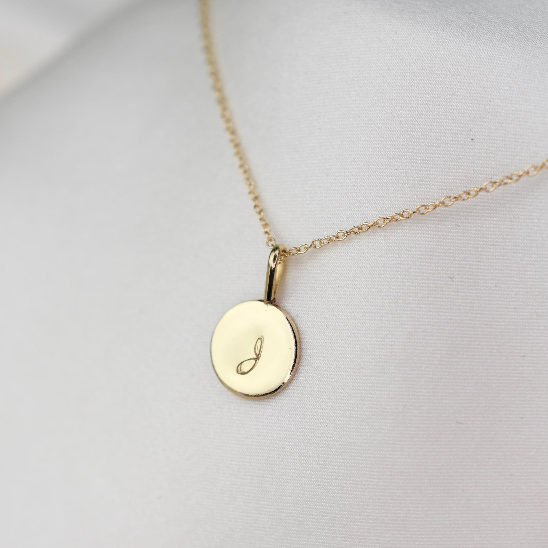 14K gold initial charm necklace featuring a minimalist gold disc pendant, designed by Sash Jewelry.