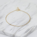 14K gold delicate anklet by Sash Jewelry featuring a dainty solid gold chain with extension for adjustable fit.