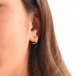 14K gold hoop earrings by Sash Jewelry, minimalist solid gold everyday earrings with a sleek, classic design.