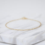 14K gold delicate anklet with extension chain, dainty solid gold jewelry anklet by Sash Jewelry, perfect for subtle ankle adornment.