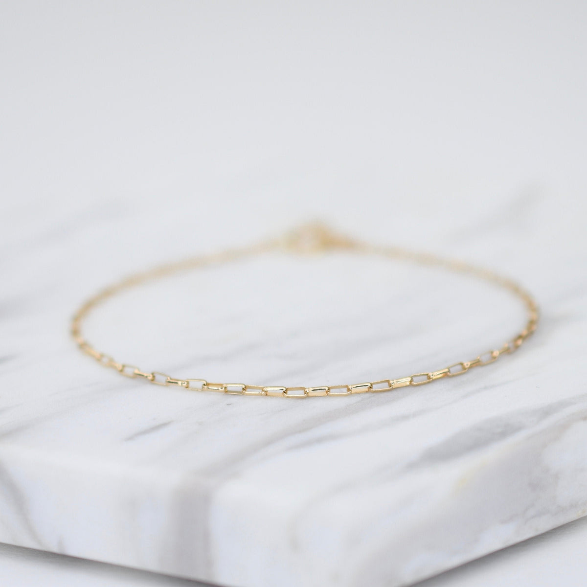 14K gold delicate anklet with extension chain, dainty solid gold jewelry anklet by Sash Jewelry, perfect for subtle ankle adornment.