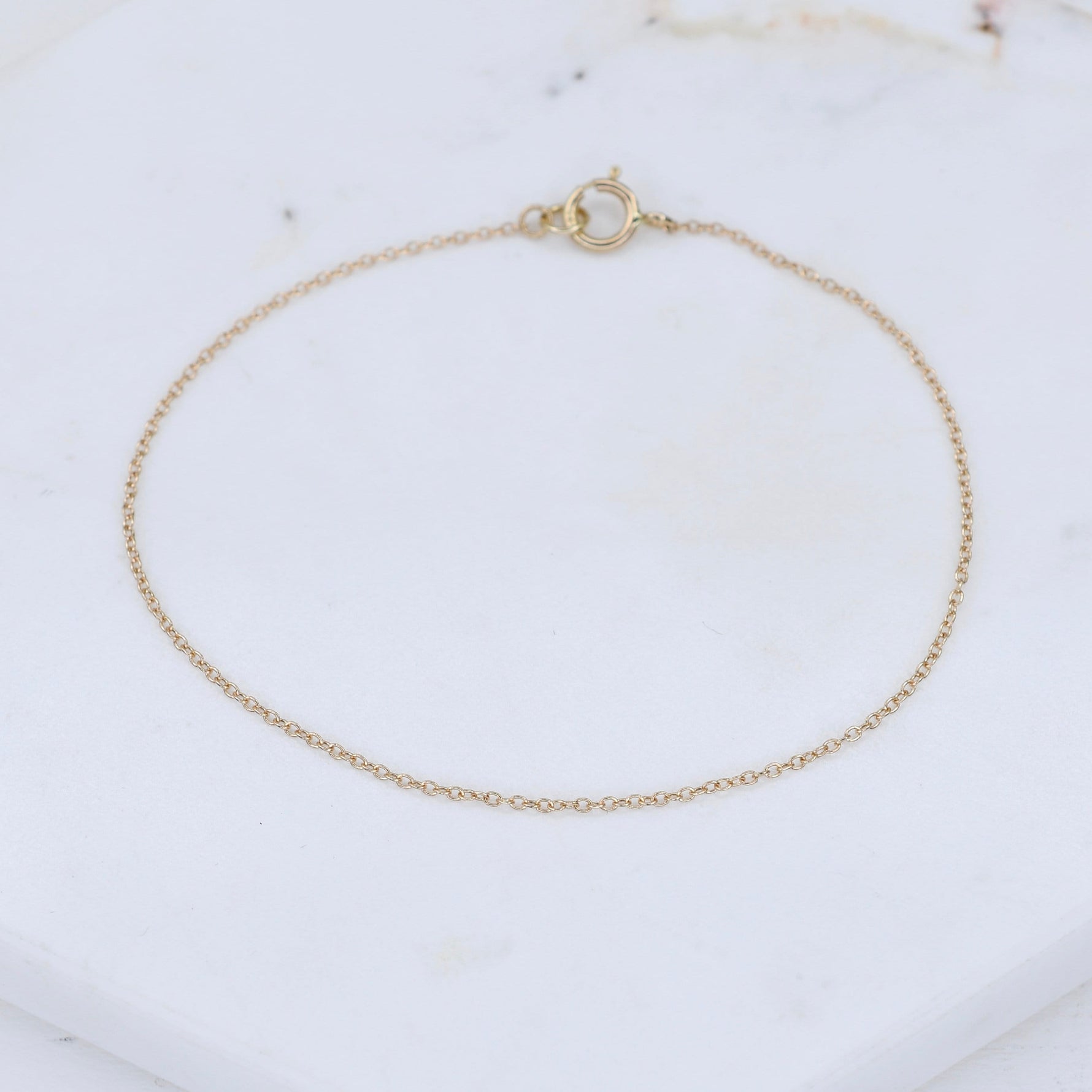 14k solid gold dainty 1mm cable chain bracelet available in yellow gold white gold and rose gold