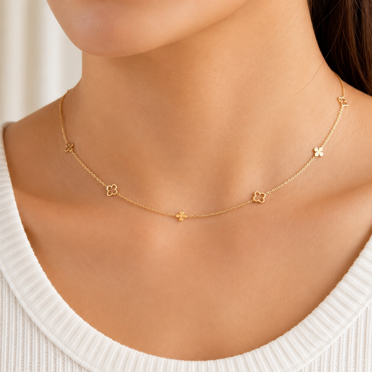 14K gold clover necklace by Sash Jewelry featuring a delicate four-leaf clover pendant on a fine chain.