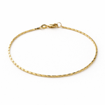 Gold bracelet on a white background