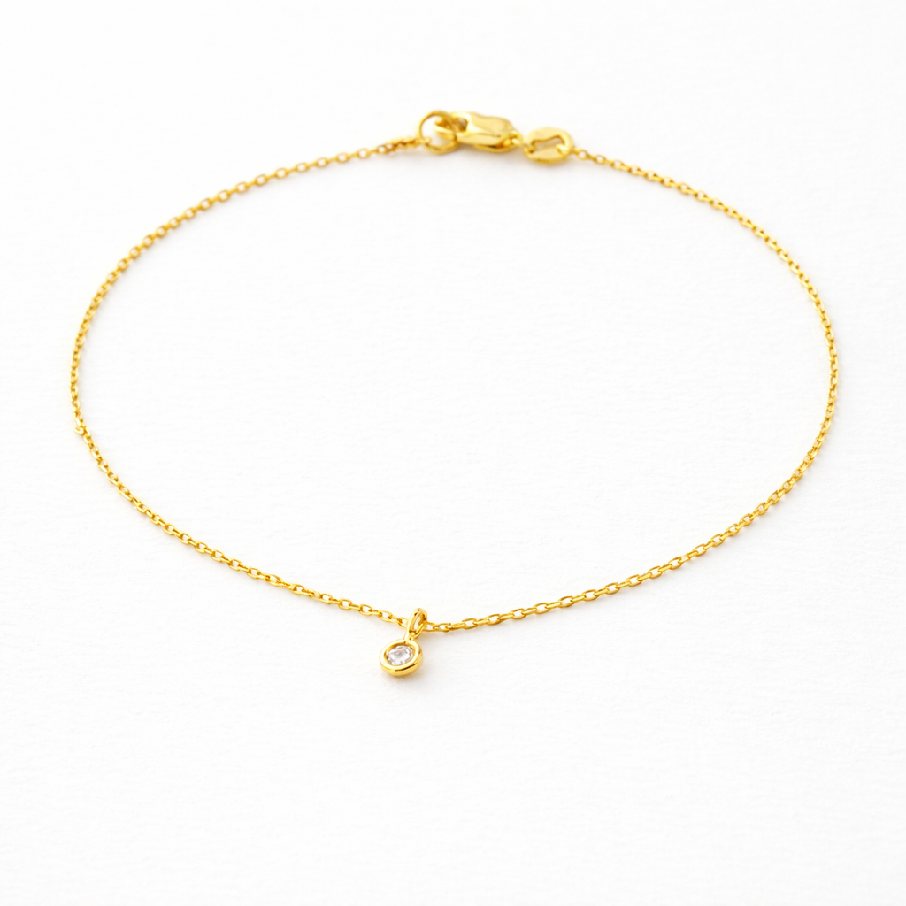 Gold bracelet on a white background