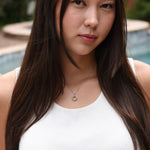 14K solid gold three interlocking rings necklace in yellow, white, and rose gold with an adjustable 16–18" chain.