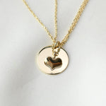 One heart pendant taken from another showing the eternal mother daughter bond.