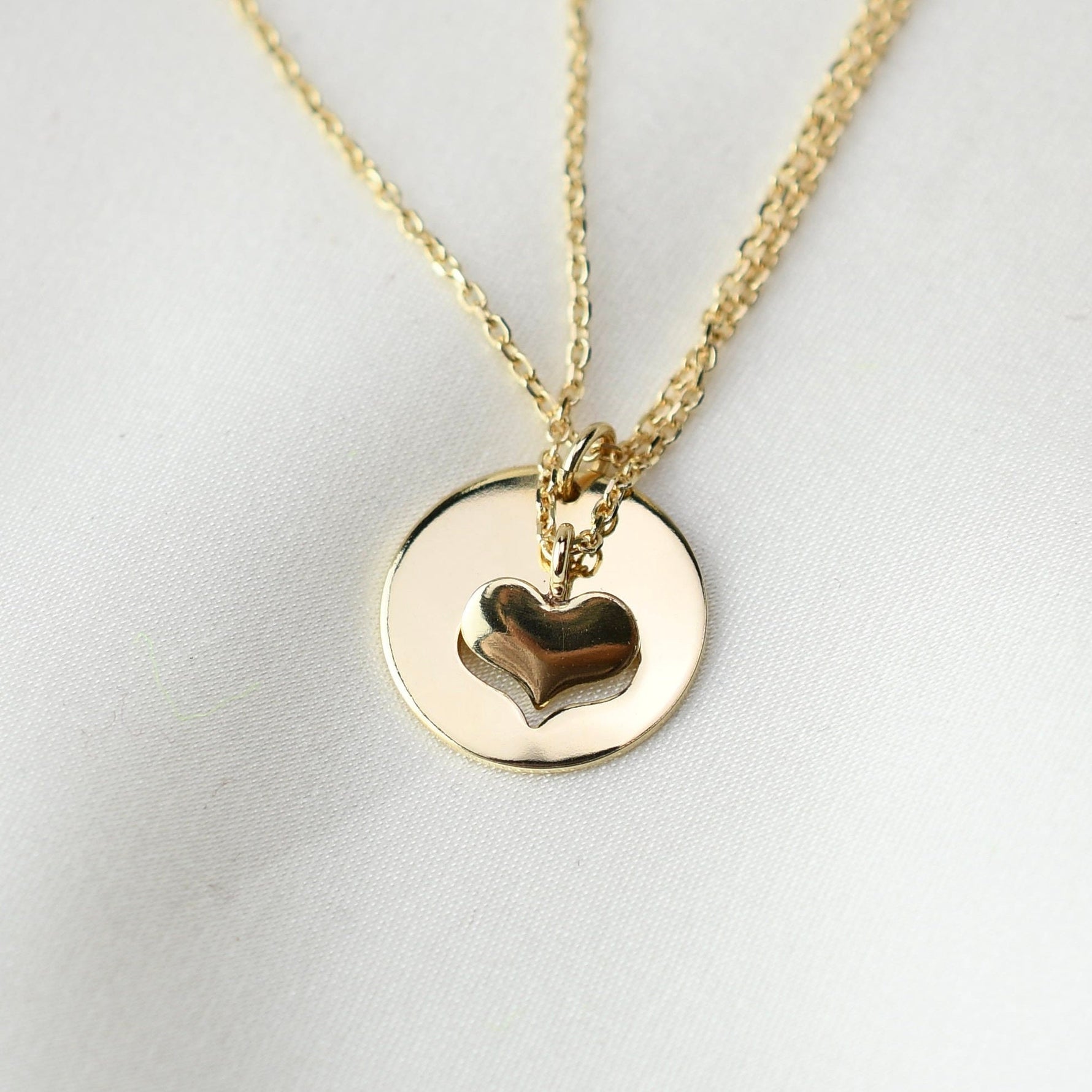 One heart pendant taken from another showing the eternal mother daughter bond.
