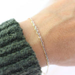14K gold dainty tri-color Singapore chain bracelet with sparkling accents, designed by Sash Jewelry.
