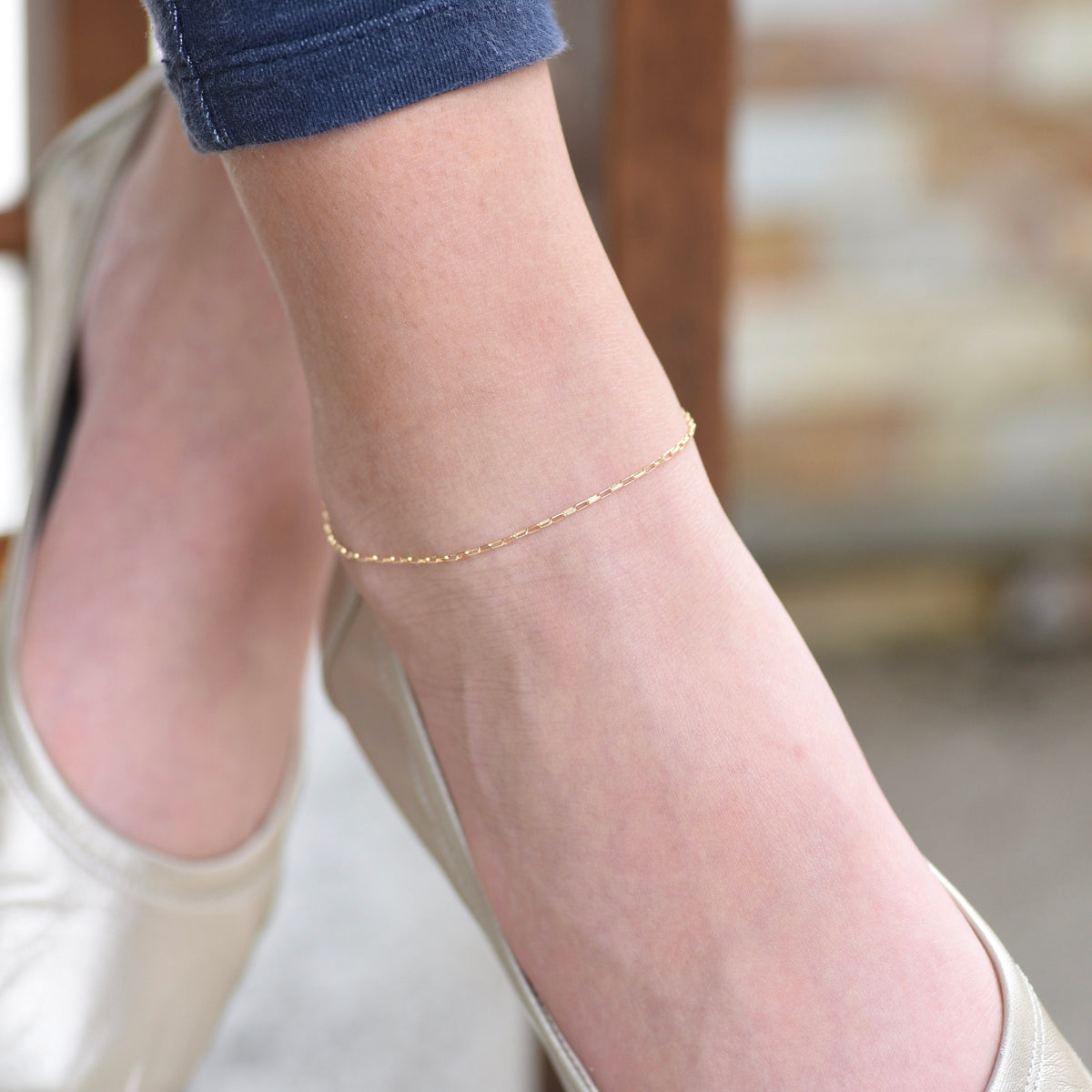 14K gold delicate anklet by Sash Jewelry featuring a dainty solid gold chain with extension for adjustable fit.