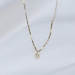 Fine 14K gold necklace with small diamond charm