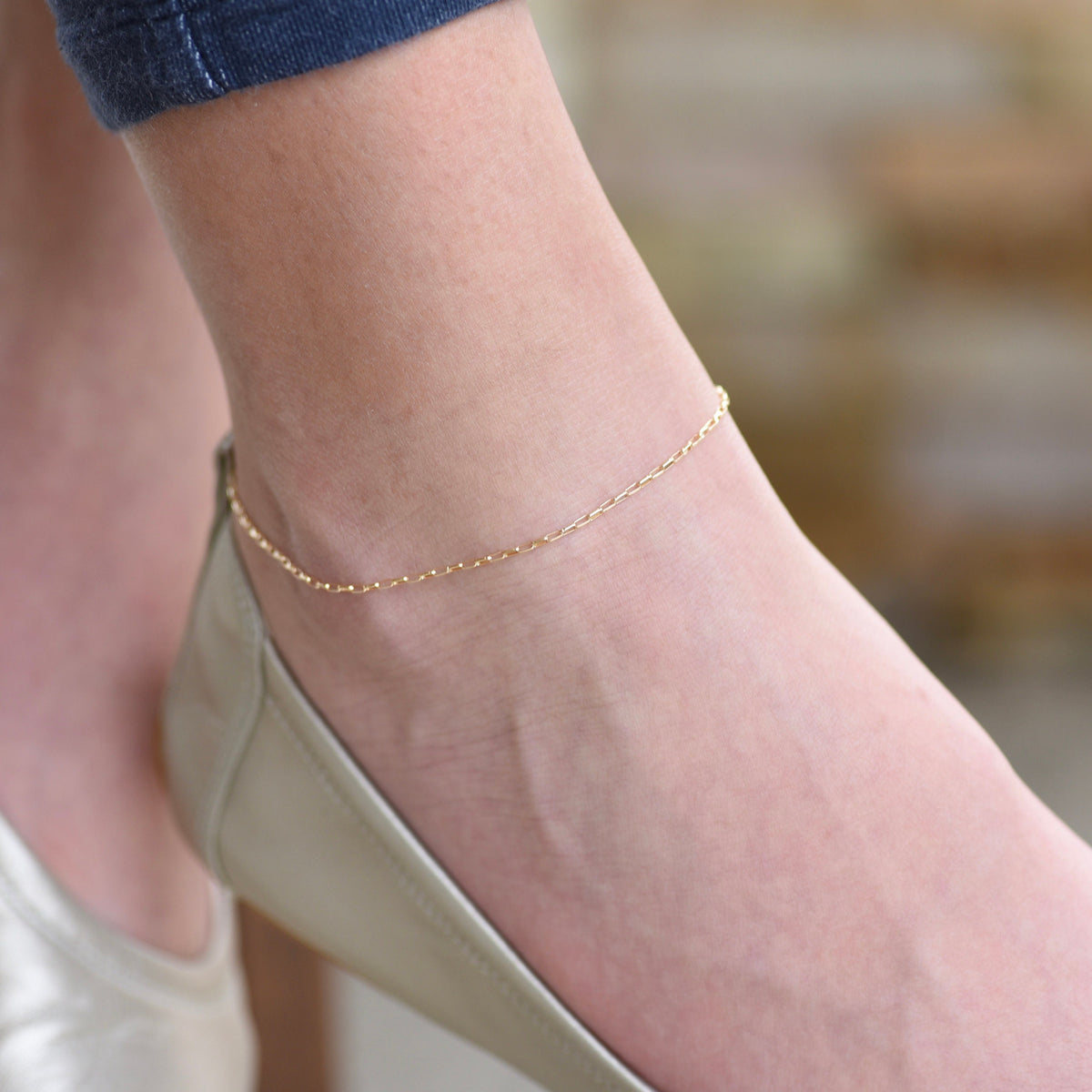 14K gold delicate anklet by Sash Jewelry featuring a dainty solid gold chain with extension for adjustable fit.