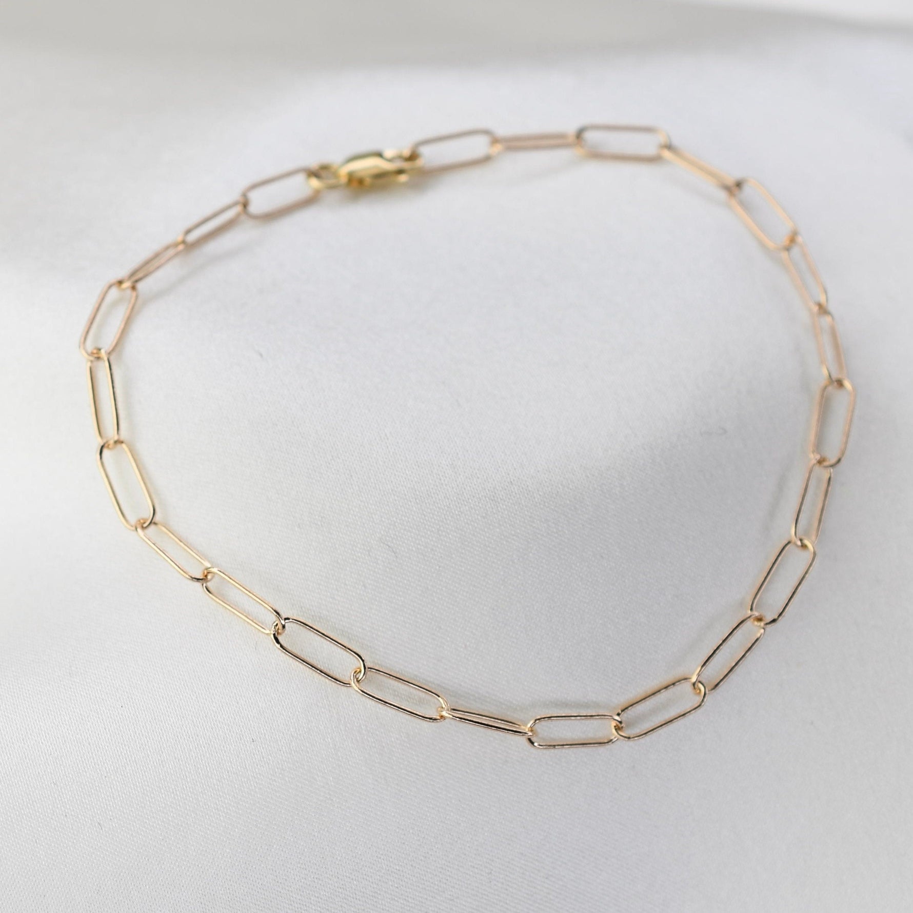 Minimalist 14K solid gold paper clip chain bracelet, 3mm wide. Perfect for everyday wear, stacking, or gifting. Durable, elegant, and timeless.