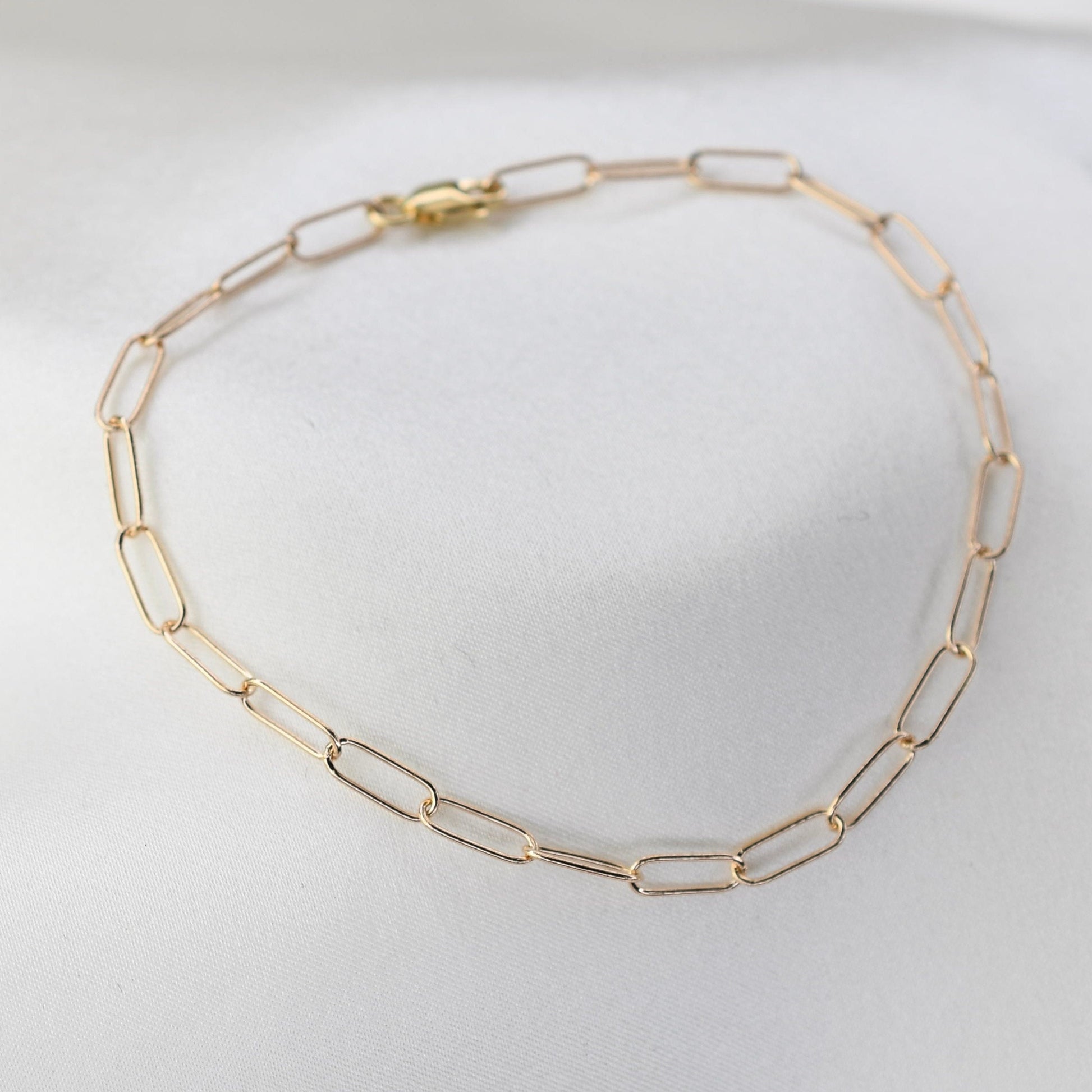 Minimalist 14K solid gold paper clip chain bracelet, 3mm wide. Perfect for everyday wear, stacking, or gifting. Durable, elegant, and timeless.