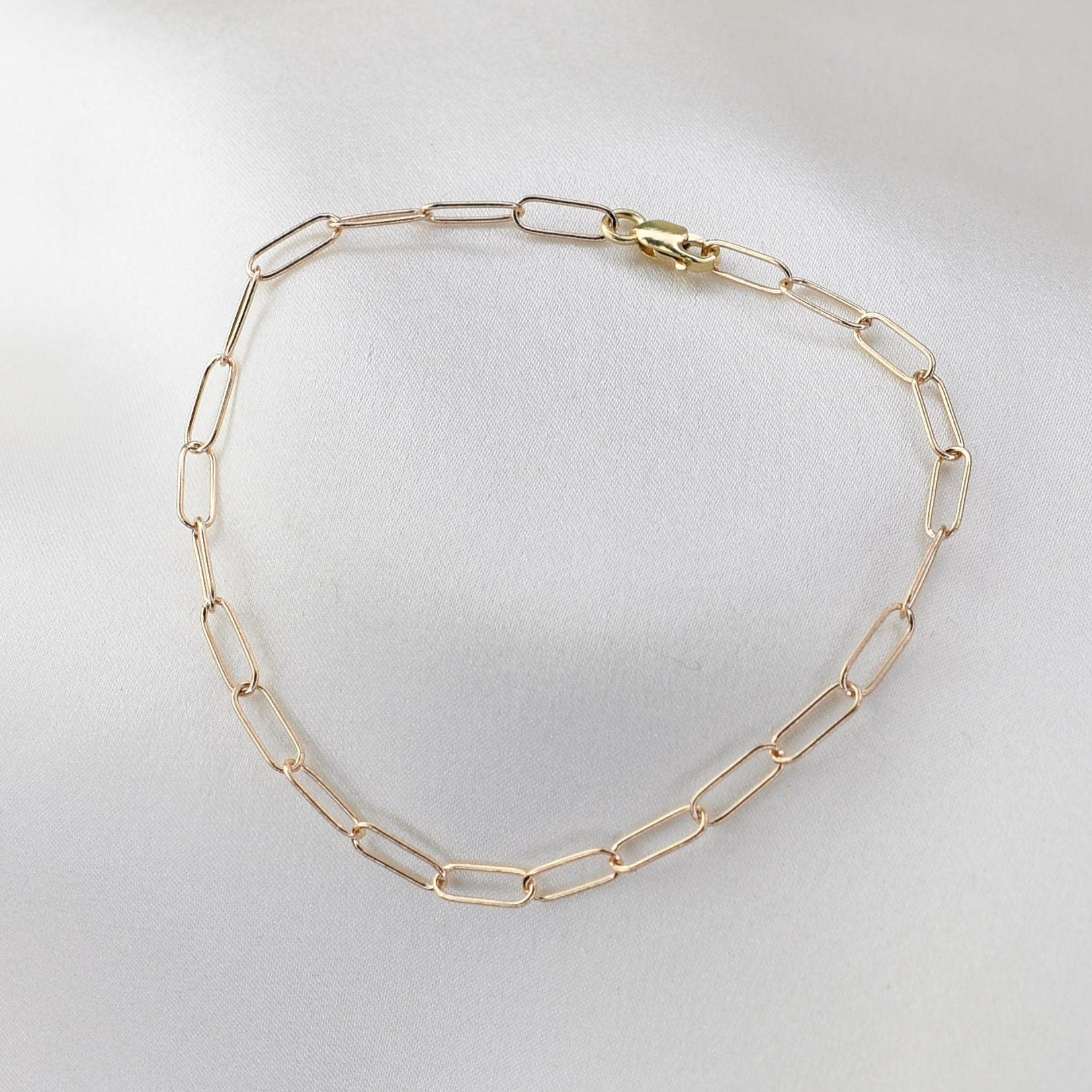 Minimalist 14K solid gold paper clip chain bracelet, 3mm wide. Perfect for everyday wear, stacking, or gifting. Durable, elegant, and timeless.