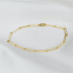 14K gold paper clip bracelet worn on wrist