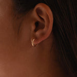 14K gold minimalist hoop earrings by Sash Jewelry, solid gold everyday earrings with a sleek, simple design.